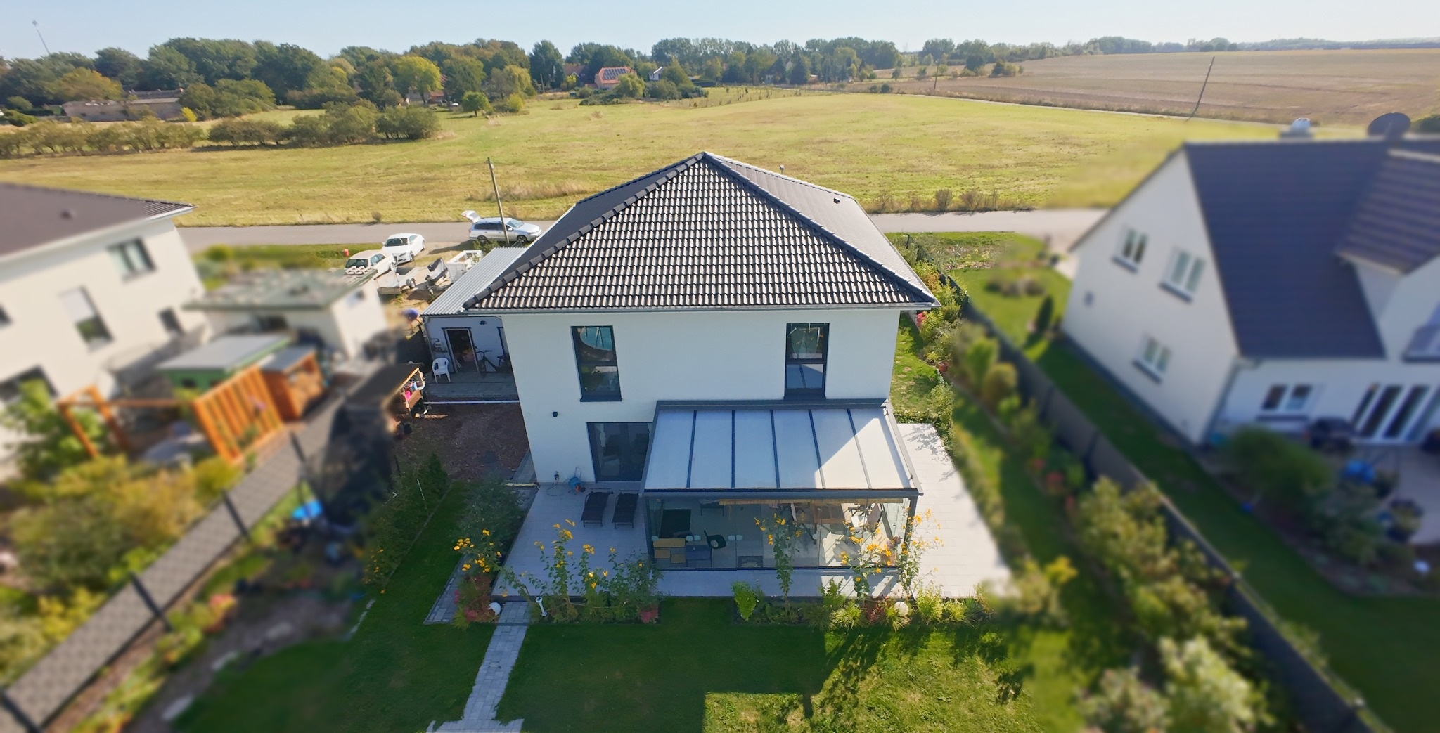 Haus mit überdachter Terrasse · Ansicht 2